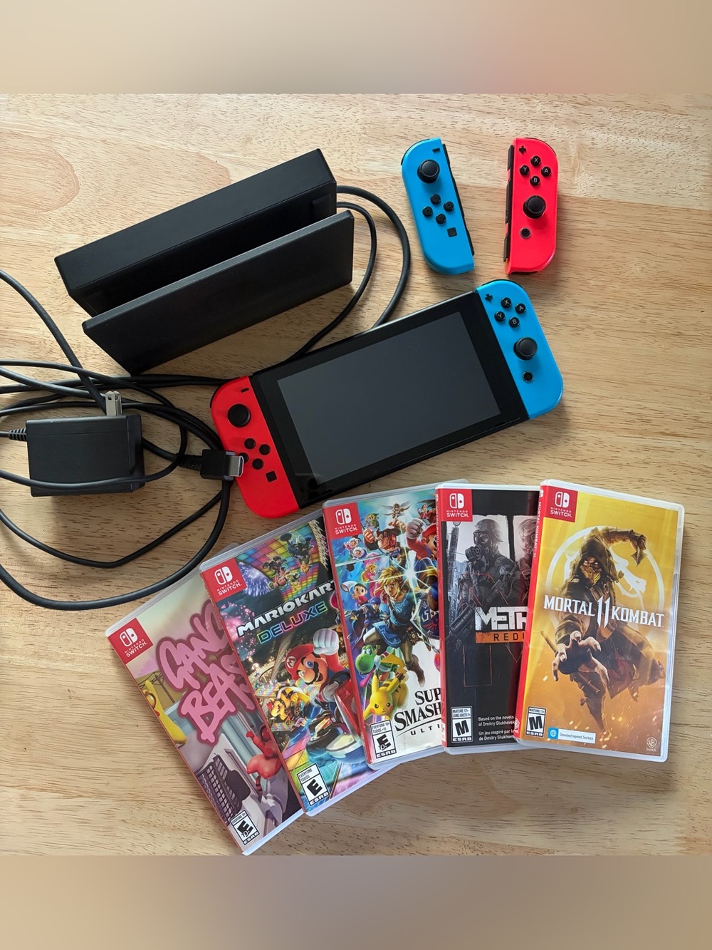 Nintendo Switch with Neon Red & Neon Blue Joy‑Con and Five Games